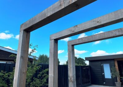 Tuinontwerp met zwembad - dubbele pergola poort zichtlijn - tuinarchitect Woerden Montfoort Utrecht